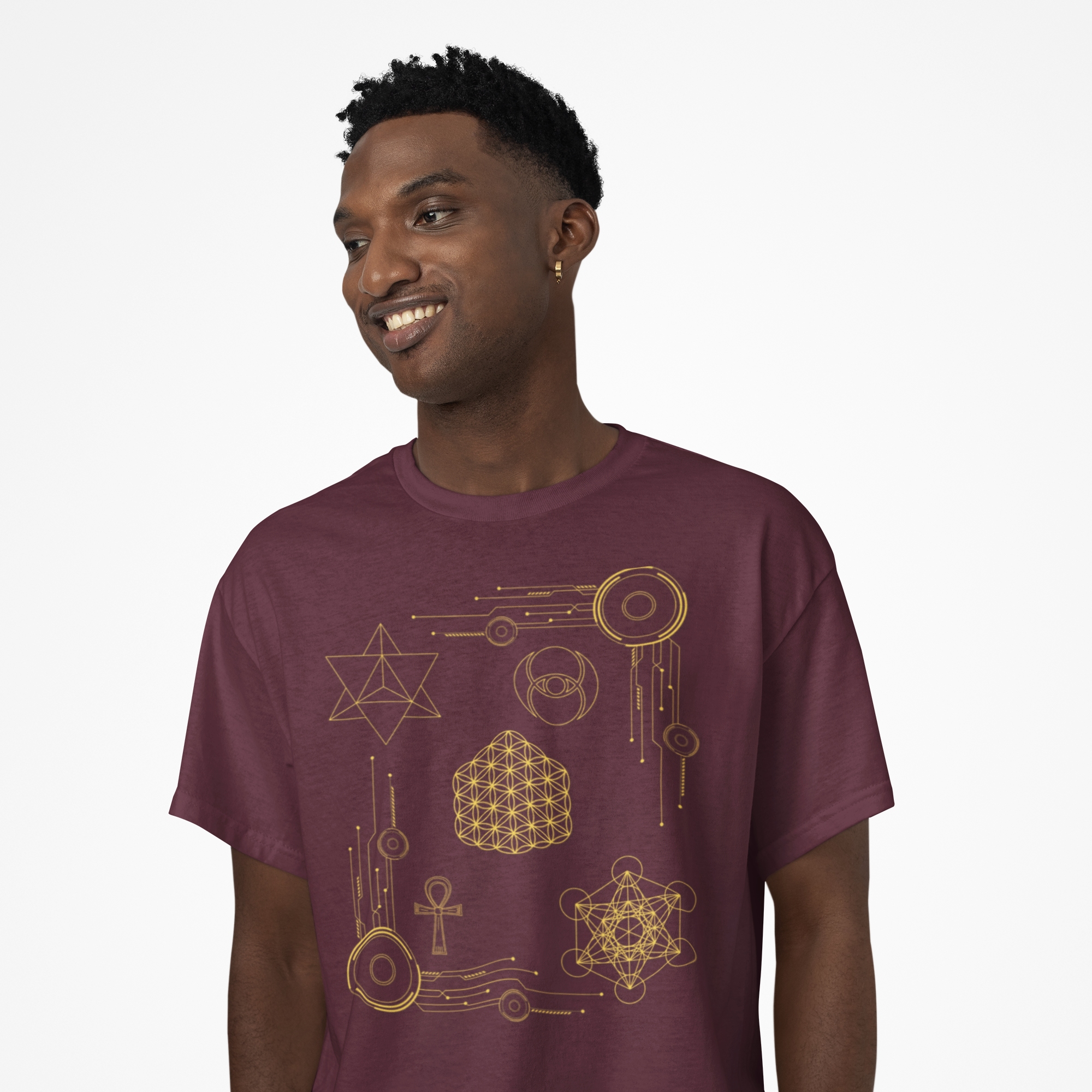 Man wearing a maroon t-shirt with gold geometric designs on a white background