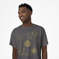 Man wearing a gray t-shirt with gold geometric designs on a white background